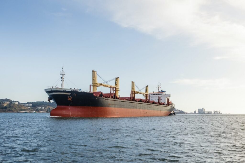 cargo ships in river being tugged e1607329984994